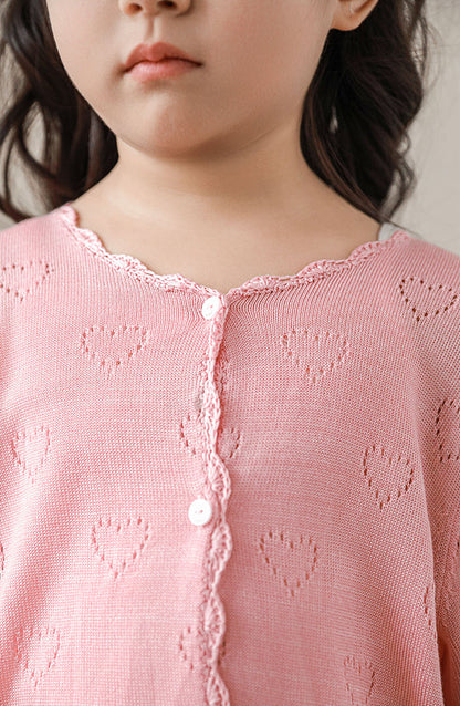 Close-up of heart knit pattern on girls lyocell cardigan, in light pink