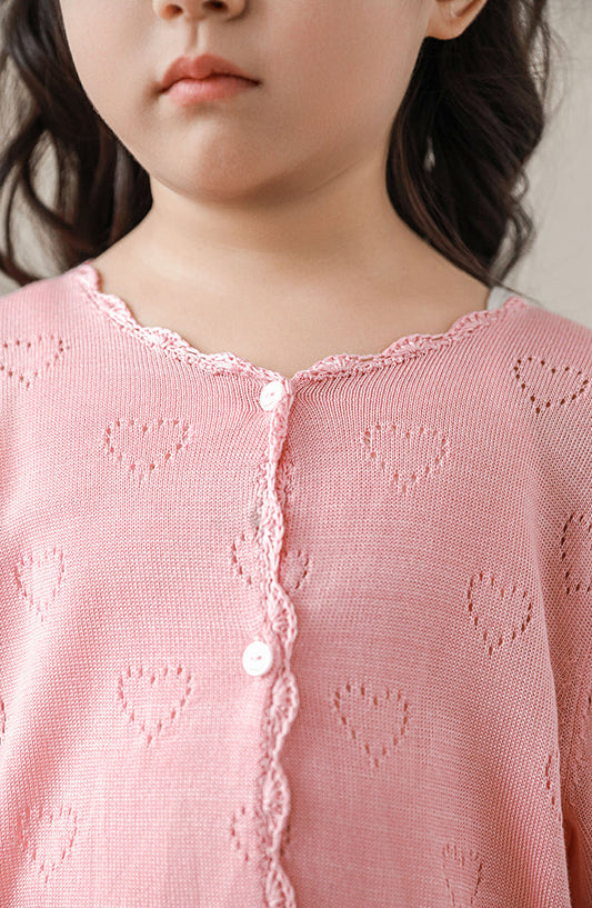 Close-up of heart knit pattern on girls lyocell cardigan, in light pink