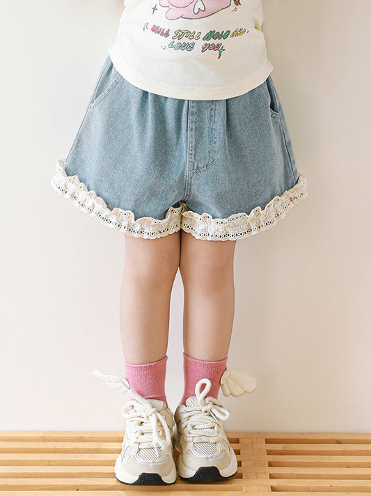 Girls blue denim shorts with lace detail on hem