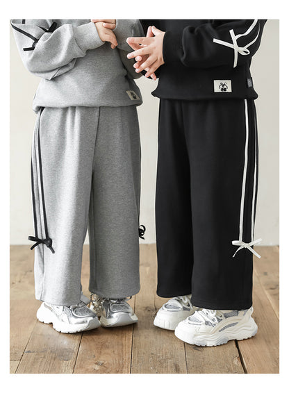 Ribbon-accented girls sweat set with adjustable cuffed ankles